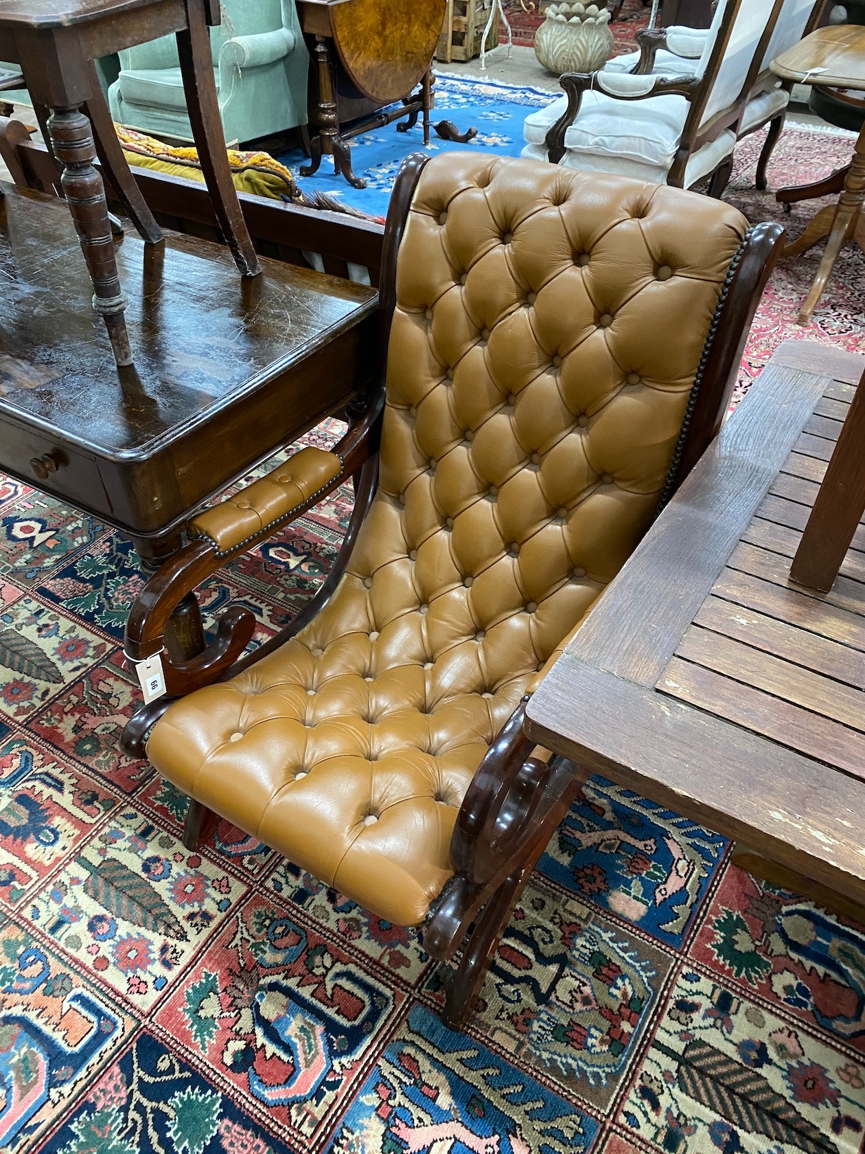 A Victorian style buttoned leather mahogany open armchair, width 63cm, depth 75cm, height 96cm